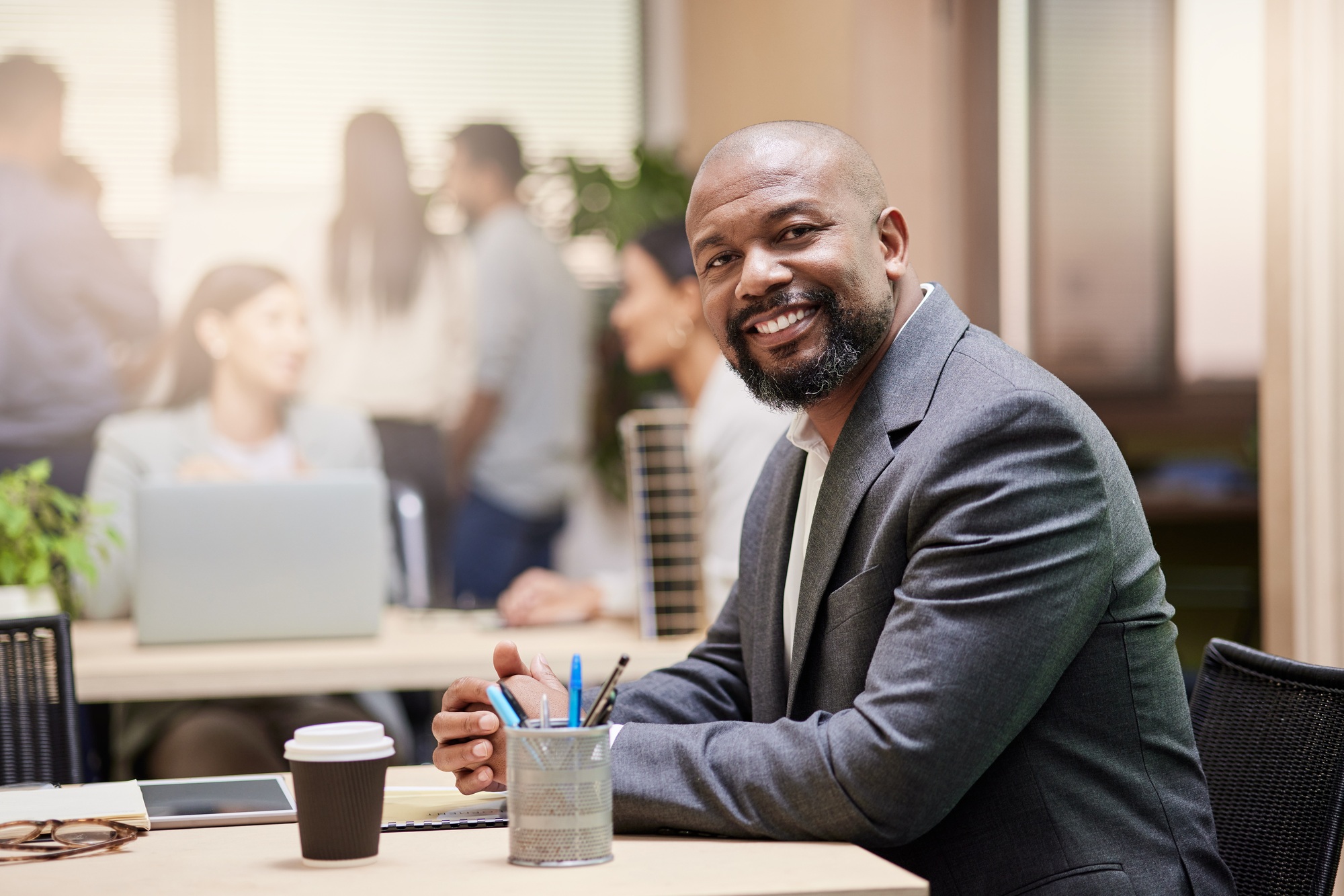 A strong leader makes a strong team. Shot of a businessman in his office.